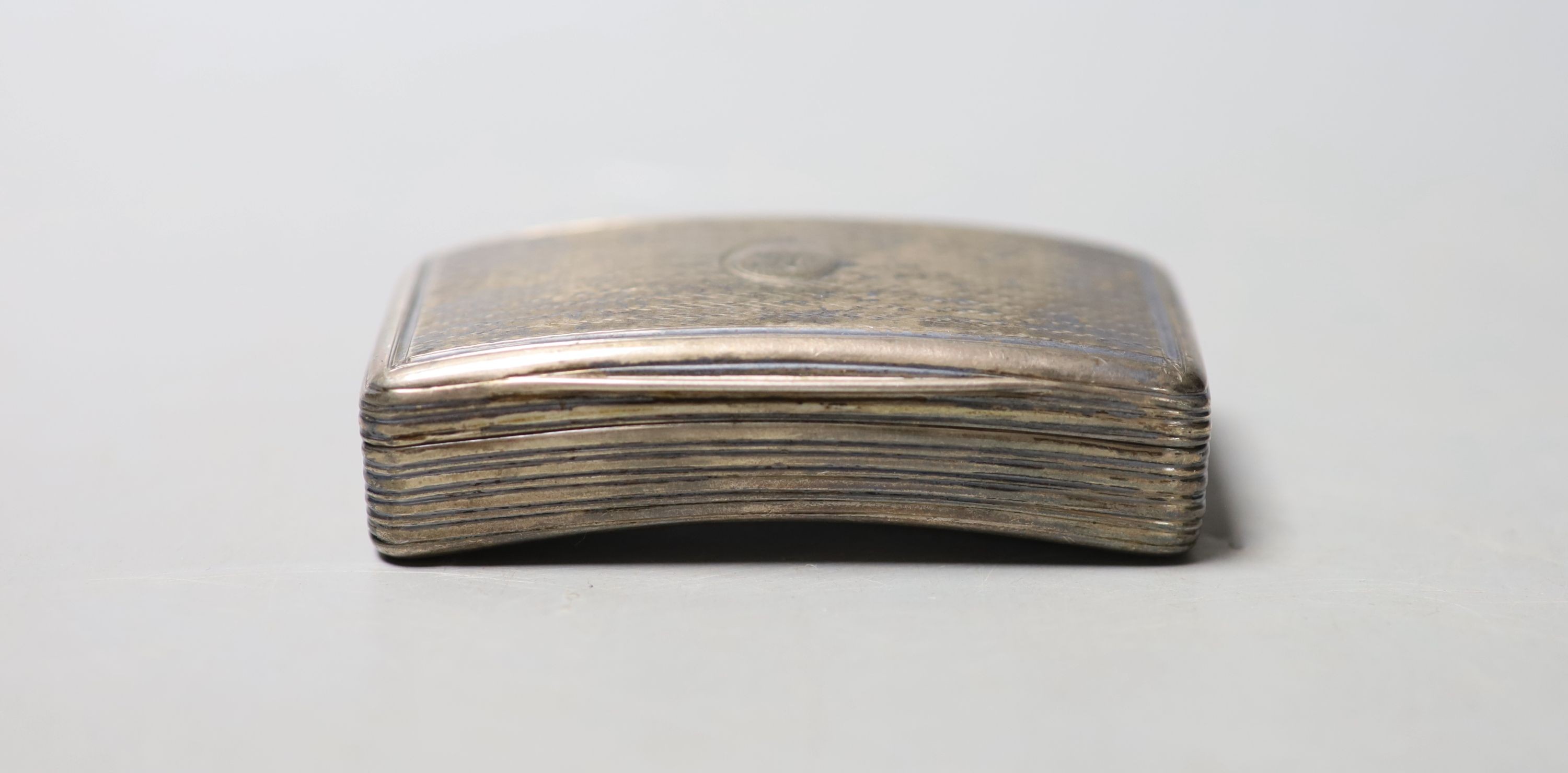 A George III engine turned silver concave snuff box, William Eaton, London, 1814, 79mm.